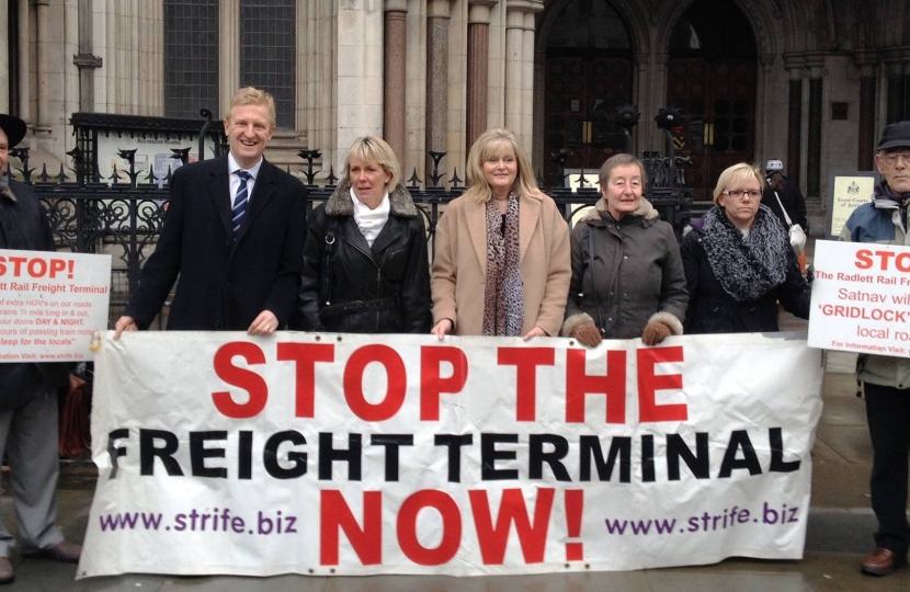 Oliver Dowden MP with anti-rail freight campaigners outside the High Court