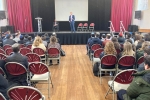 Oliver speaking to the Sixth Form