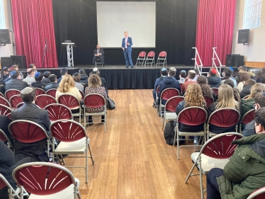 Oliver speaking to the Sixth Form
